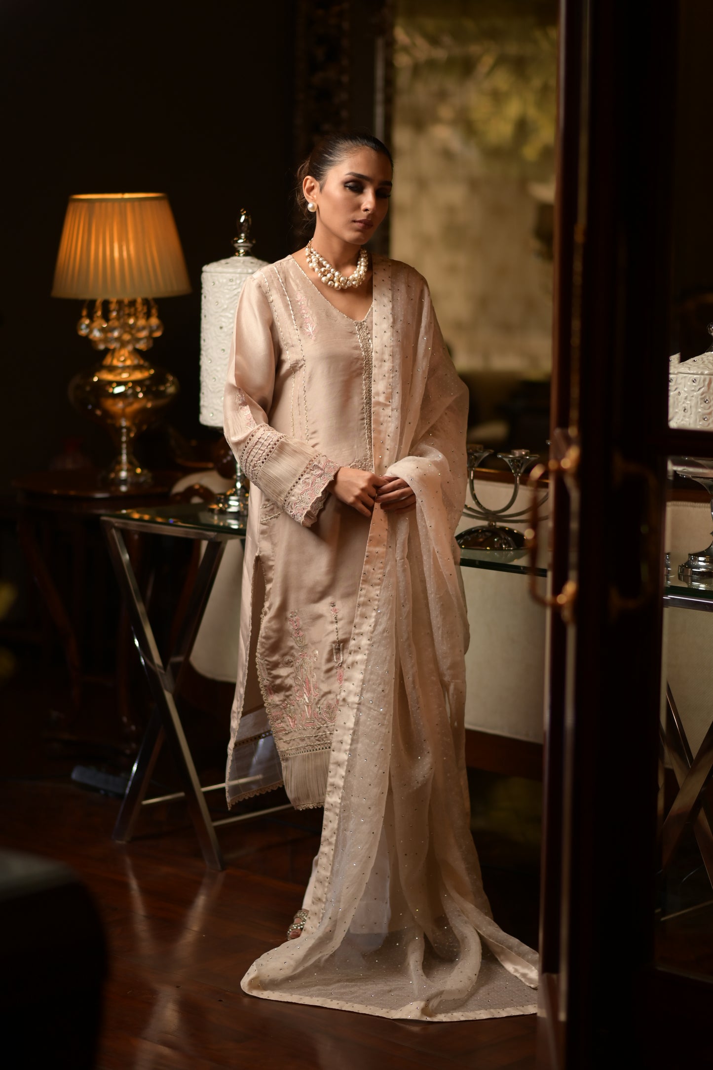 Elegant model wearing a tussar silk kurta with intricate lace detailing and diamante embellishments, perfect for Eid celebrations.